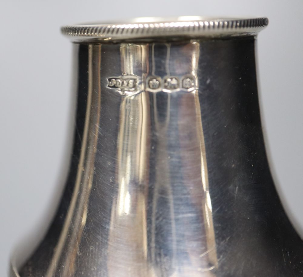 Four assorted 20th century silver casters, including a small pair, tallest 19.3cm, 11.5oz.